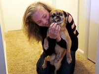 Skyla Lynk-Romano, 15, enjoys a fun moment with her dog, Charly, before leaving for her first day of school.  Skyla Lynk-Romano who suffered a traumatic brain injury when she was struck by a car on January 5th attends her first day of school at the Greater New Bedford Regional Vocational Technical High School after a long rehabilitation process at the Pappas Rehabilitation Hospital for Children in Canton, MA. On January 5, 2017, Skyla, a freshman at Greater New Bedford Regional Vocational-Technical High School, was crossing Dartmouth Street to meet her father after leaving the Dancer’s Edge studio when she was hit by a car and critically injured. The driver, Jessica Skaggs, 34, fled the scene before turning herself in. Skaggs has been sentenced to six months at the House of Corrections, but the sentense was suspended for two years. PHOTO PETER PEREIRA